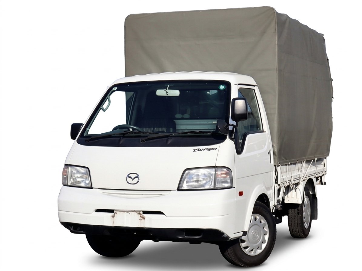 幌を付けた白い小型トラック